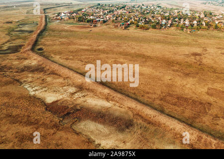 Aerial view of embankment protecting village from river overflowing and flooding area Stock Photo