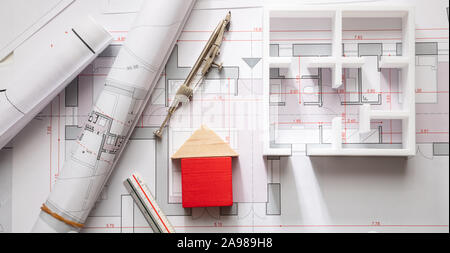 House model and blueprint plans, residential building project architectural design, banner Stock Photo