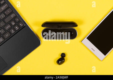 Flat lay composition with Electronics devices on yellow background Stock Photo