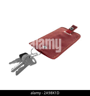 Simple red  leather key holder with three keys isolated on white background Stock Photo