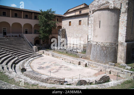 Ancient Teatro Romano (Roman Theatre) from I CE and Romanesque Chiesa di Sant'Agata (church of Sant’Agata) in Museo Archeologico Nazionale in historic Stock Photo