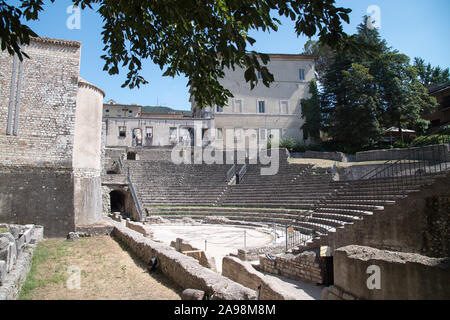 Ancient Teatro Romano (Roman Theatre) from I CE and Romanesque Chiesa di Sant'Agata (church of Sant’Agata) in Museo Archeologico Nazionale in historic Stock Photo