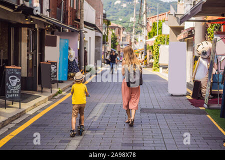 Mom and son tourists in Bukchon Hanok Village is one of the famous place for Korean traditional houses have been preserved. Travel to Korea Concept Stock Photo