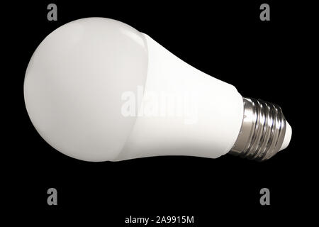 Led bulb light and energy-saving lamp on table on black background. Energy saving concept Stock Photo