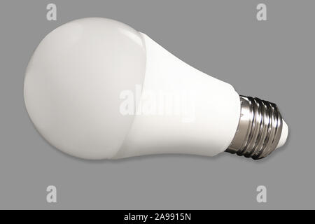 Led bulb light and energy-saving lamp on table on gray background. Energy saving concept Stock Photo
