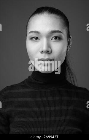 Face of young androgynous Asian transgender woman Stock Photo - Alamy