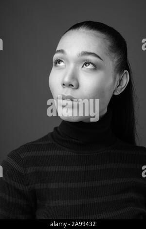 Face of young androgynous Asian transgender woman Stock Photo - Alamy