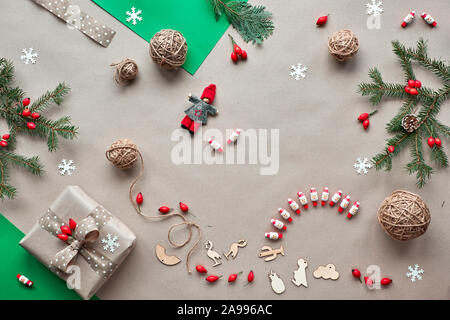 Flat lay, top view on craft paper background..Zero waste Christmas, concept flat layout on rustic wood. Hand crafted gifts, natural Christmas decorati Stock Photo