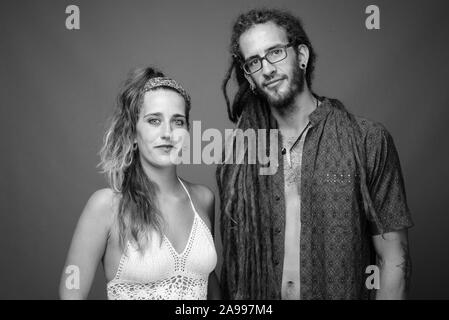 Studio shot of young Hispanic couple together in black and white Stock Photo