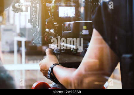 filming crew. cameraman shooting film scene with camera Stock Photo