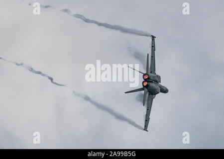 DAYTON, OHIO / USA - June 20, 2015: A United States Navy F/A-18 Super Hornet performs a demo at the 2015 Vectren Dayton Airshow. Stock Photo