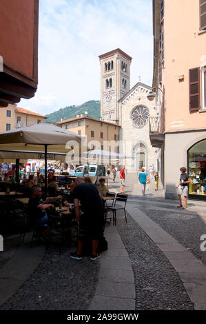 Como, Lombardy, Italy - 6th July 2019 : View of the Chiesa San Fedele (Saint Fedele Church) and a terrace of a restaurant on the San Fedele square in Stock Photo