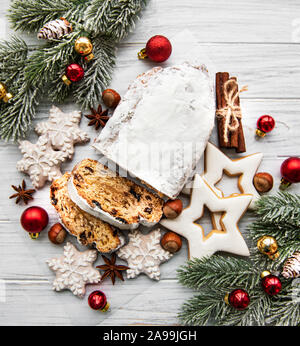 Christmas stollen on wooden background. Traditional Christmas festive pastry dessert. Stollen for Christmas. Stock Photo