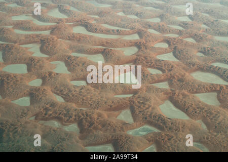 Aerial view of the colorful sand dunes of the Rub' al Khali desert, the so-called Empty Quarter, in the Eastern part of Saudi Arabia Stock Photo