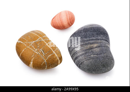 Smooth sea pebbles isolated on a white background. Colored stones close-up. Stacked photo Stock Photo