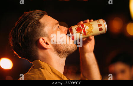 party friends drinking ganzberg beer at bar or pub Stock Photo