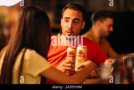 party friends drinking ganzberg beer at bar or pub Stock Photo