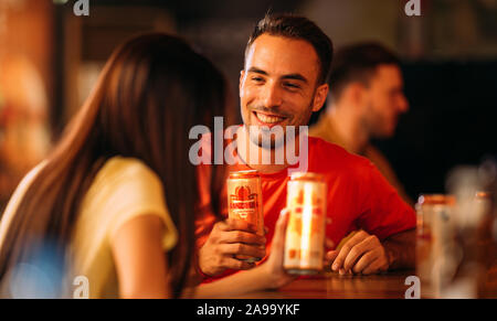 Party happy friends drinking ganzberg beer at bar or pub Stock Photo