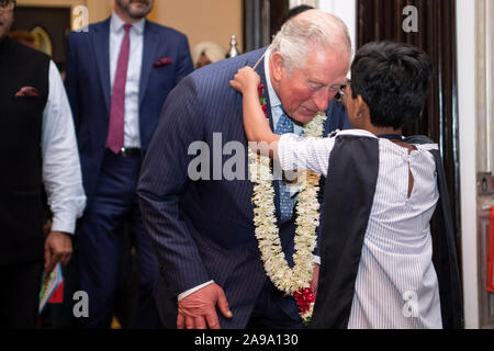 The Prince of Wales receives a flower garland during a British Asian Trust reception in Mumbai, on day two of the royal visit to India. Stock Photo