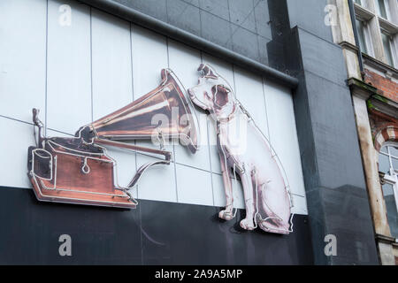 Closeup of 'Nipper' outside the now-closed His Masters Voice (HMV) flagship record store, 363 Oxford Street, London, UK Stock Photo