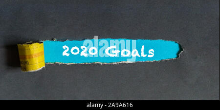Torn paper or paper hole with words, 2020 New Year Goals Stock Photo