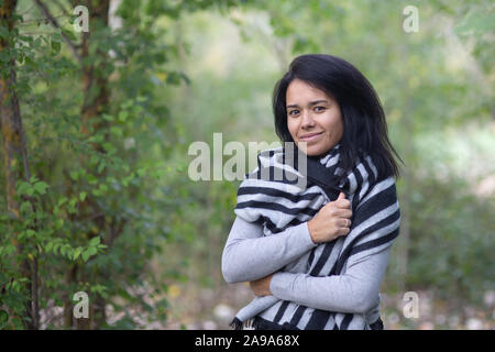 Portrait of young brunette woman in autumn Stock Photo