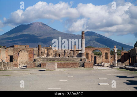 Pompei. Italy. Archaeological site of Pompeii. View of the Civil Forum (Foro Civile), towards the Capitolium, Mount Vesuvius in the background.  Regio Stock Photo
