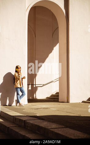 Pretty young woman talking on her phone Stock Photo