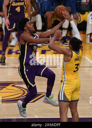 Los Angeles, United States. 13th Nov, 2019. Lakers guard Quinn Cook (L) drives on Warriors guard Jordan Poole (R) in fourth quarter action at Staples Center in Los Angeles, November 13, 2019. The Lakers beat the Warriors 120-94. Photo by Jon SooHoo/UPI Credit: UPI/Alamy Live News Stock Photo