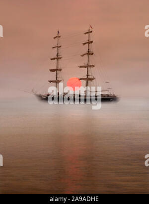 Dawn over the yard arm Stock Photo