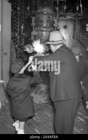 Visiting a blast furnace works, Germany 1930s. Stock Photo