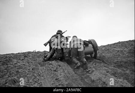 Soldiers of the German Wehrmacht practising and exercising on a military exercising ground, Germany 1930s. Stock Photo