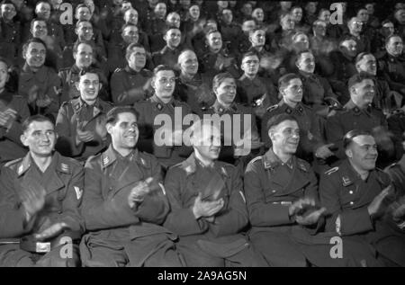 Wehrmacht and SS soldiers as audience at the 'Wunschkonzert der Wehrmacht', Germany 1940s. Stock Photo