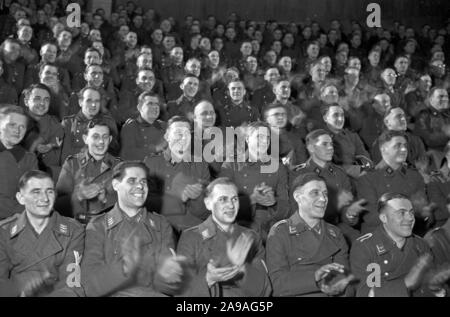Wehrmacht and SS soldiers as audience at the 'Wunschkonzert der Wehrmacht', Germany 1940s. Stock Photo