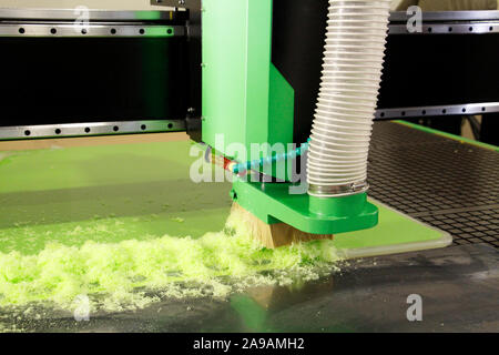 Plexiglass milling on CNC machines. A modern CNC machine processes acrylic at a furniture factory. Plexiglass processing on the CNC wall. Modern 3D te Stock Photo