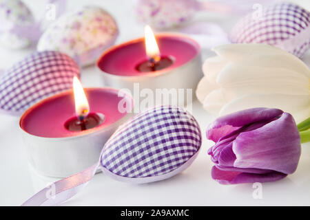 Easter decoration eggs and candles Stock Photo