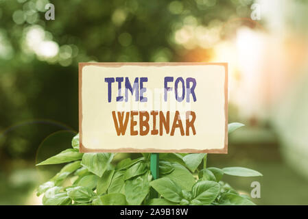 Text sign showing Time For Webinar. Business photo text seminar conducted over the Internet Web conferencing Plain empty paper attached to a stick and Stock Photo