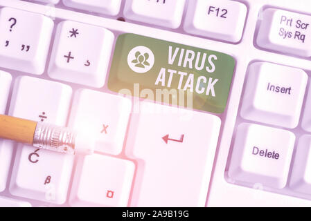 Handwriting text writing Virus Attack. Conceptual photo malicious program that perform actions unauthorized by the user White pc keyboard with empty n Stock Photo