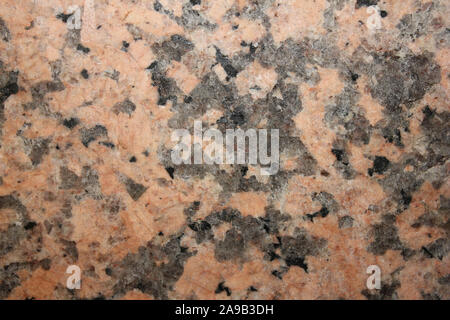 Red Granite -  a type of granite rich in the mineral potassium feldspar (k-spar) Stock Photo