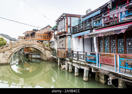 Stone bridge and old buildings in Zhujiajiao, an ancient water town in Shanghai, best known for its bridges, built during Ming and Qing Dynasties, the Stock Photo