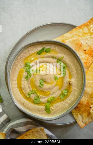 Baba ganoush,Arabian appetizer roasted  eggplant dip served with Pita chips Stock Photo