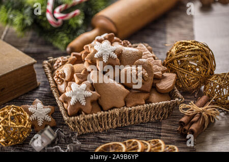 Gingerbread christmas cookies on kitchen table - Close-up. Stock Photo