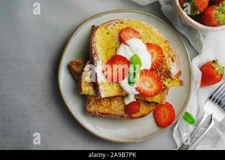 Breakfast French toast with berries, overhead view Stock Photo