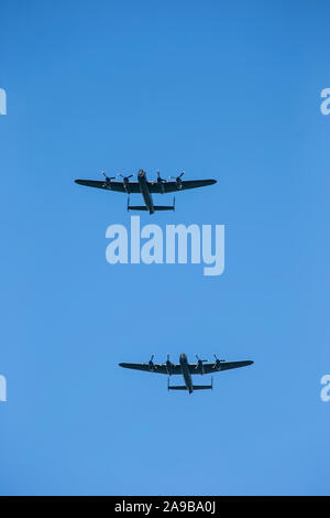 The two remaining airworthy Avro Lancaster British four-engined Second World War heavy bombers in a ceremonial flypast over Holmfirth, West Yorkshire Stock Photo