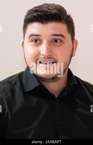 Stuttgart, Germany. 14th Nov, 2019. Ferdinand Dedaj, a specialist in geriatric care with a Kosovan background, takes part in the press conference of Diakonie. Since 2015, more than 260 young Kosovars have begun training in nursing care for the elderly at Baden-Württembergische Diakonie, the welfare association of the Protestant Church. Credit: Tom Weller/dpa/Alamy Live News Stock Photo