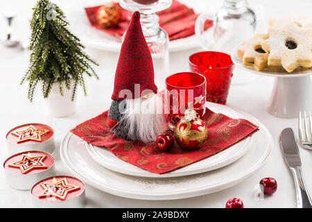 Christmas And New Year Holiday Table Setting. Celebration. Place setting for Christmas Dinner. Holiday Decorations. Decor. Stock Photo
