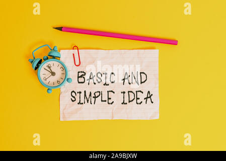 Conceptual hand writing showing Basic And Simple Idea. Concept meaning Plain Mental Images or Suggestions a Common Perception Metal alarm clock ccrush Stock Photo