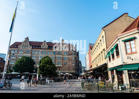 Malmo, Sweden - August 28, 2019: Lilla Torg, a square with many bars, restaurants and shops in the old town of Malmö with people around in Sweden Stock Photo