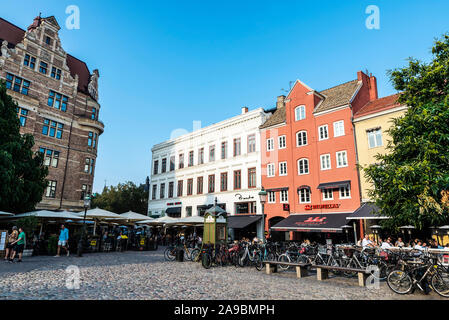 Malmo, Sweden - August 28, 2019: Lilla Torg, a square with many bars, restaurants and shops in the old town of Malmö with people around in Sweden Stock Photo