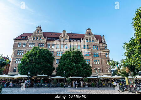 Malmo, Sweden - August 28, 2019: Lilla Torg, a square with many bars, restaurants and shops in the old town of Malmö with people around in Sweden Stock Photo